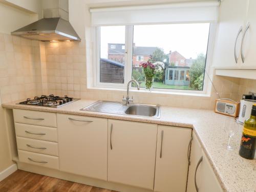 a kitchen with a sink and a window at 8 Hampton Road in North Shields