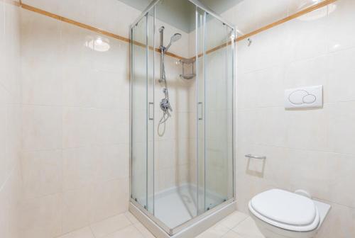 a bathroom with a shower and a toilet at Milan Retreats in Milan