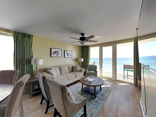 a living room with a couch and a table at Sea Dunes #401 in Fort Walton Beach