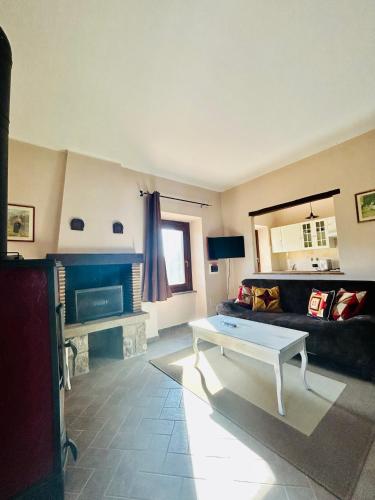 a living room with a couch and a coffee table at Podere La Branda in Vetralla