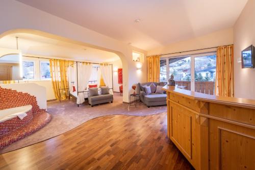 a living room with a couch and a table at VÖTTER'S HOTEL in Kaprun - summer card included in Kaprun