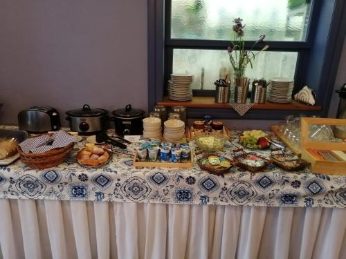 a table with a table cloth with food on it at HolidayPark Mlázovy in Kolinec
