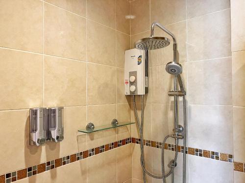 a shower with a shower head in a bathroom at Mantra Pattaya Pool Villa-Pool with Jacuzzi in Pattaya-Pet-Friendly in Jomtien Beach