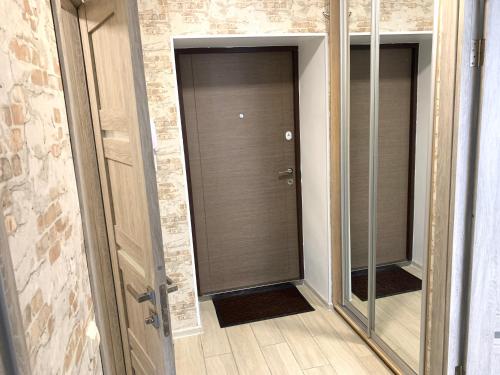 a hallway with two mirrors in a room at Комфортна квартира. Поруч парк in Ternopilʼ