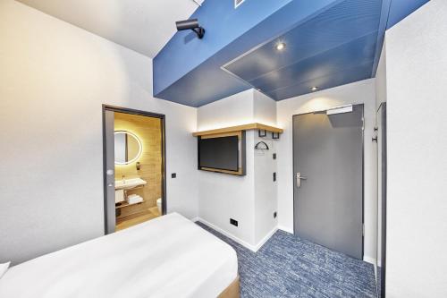 En eller flere senge i et værelse på H2 Hotel Düsseldorf Seestern