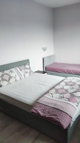 Postel nebo postele na pokoji v ubytování LILIYA Apartment