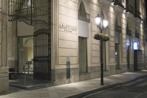 a building with a street light in front of it at Hospes Amérigo, Alicante, a Member of Design Hotels in Alicante