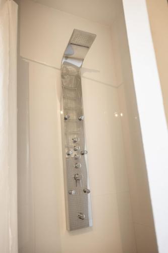 a bathroom with a walk in shower with a mirror at B&B Cá Bianca Ventisette Riccione in Riccione