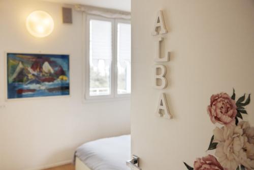 a room with a bed and a sign that says relax at B&B Cá Bianca Ventisette Riccione in Riccione