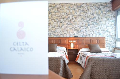 Postel nebo postele na pokoji v ubytování Hotel Celta Galaico