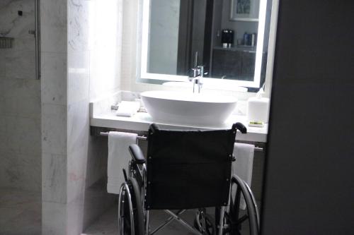 a wheelchair sitting in front of a bathroom sink at InterContinental Real Santo Domingo by IHG in Santo Domingo
