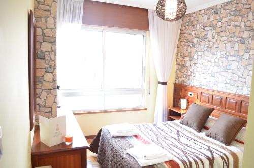 Postel nebo postele na pokoji v ubytování Hotel Celta Galaico