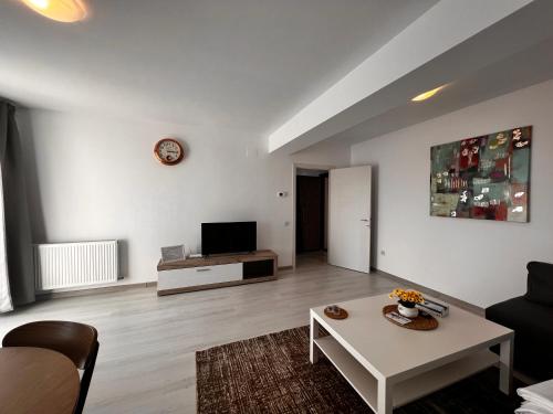 Телевизор и/или развлекательный центр в Libertatii Gardens Residences