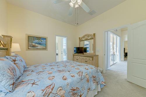 a bedroom with a bed and a dresser and a television at Tuscan Pines Villa in Davenport