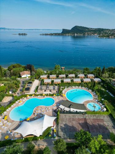 an aerial view of a resort with two swimming pools at Campeggio Europa Silvella in San Felice del Benaco
