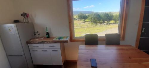 Kuchyň nebo kuchyňský kout v ubytování Cabañas Kápenken, #2