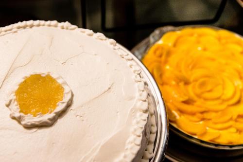 a white cake sitting on top of a table at Pousada Sossego da Pampulha in Belo Horizonte