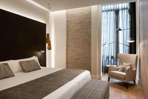 Letto o letti in una camera di Catalonia Gran Vía Madrid