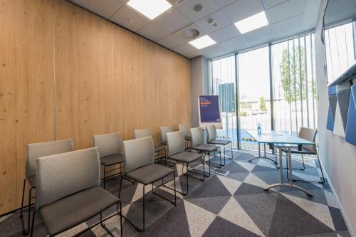 a conference room with chairs and a table in it at Holiday Inn Express Warsaw - Mokotow by IHG in Warsaw