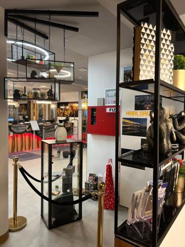 a store with a shelf with items on it at Design Hotel Winterrot in Karlsruhe