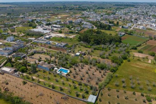an aerial view of a town with houses and trees at Casa Ulmi con piscina in Uggiano la Chiesa