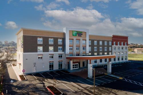 an empty parking lot in front of a hotel at Holiday Inn Express & Suites - Hollister by IHG in Hollister
