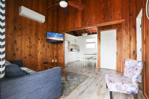a living room with a couch and a table at The Southwinds in Cape May