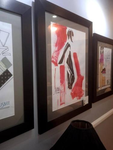 three framed pictures of a woman on a wall at McKinley Hills BGC Taguig City Condo in Manila