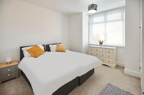 a bedroom with a large bed and a window at Host & Stay - Fairfield in Manchester