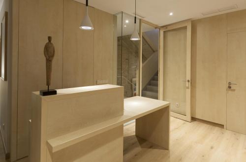 a bathroom with a counter with a statue on it at San Gil Plaza Hotel in Zamora