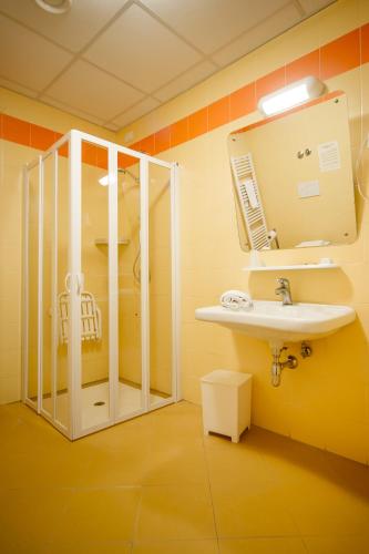 a bathroom with a sink and a mirror at Hotel Foresteria in Volterra