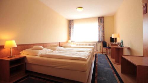 Ένα ή περισσότερα κρεβάτια σε δωμάτιο στο Friends Hotel Kerpen