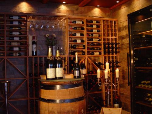 a wine tasting room with a barrel and wine glasses at Hotel Faaborg Fjord in Fåborg