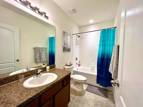 a bathroom with a sink and a toilet at A Cozy Home Away From Home in Riverview