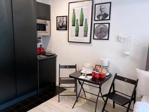 a room with a table with bottles on the wall at Revelton Studios Prague in Prague