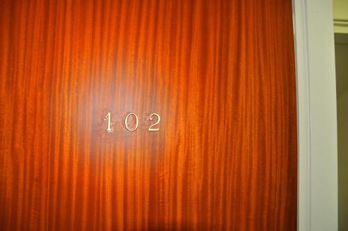 a red curtain with the number on it at Nora Hotel in Sitia