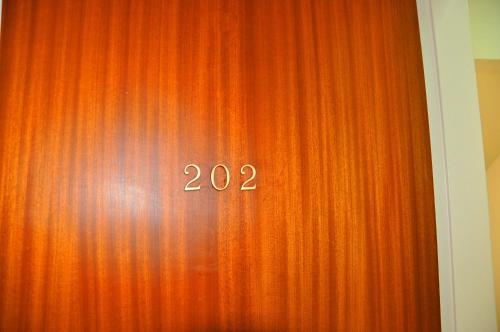 a red curtain with the number on it at Nora Hotel in Sitia