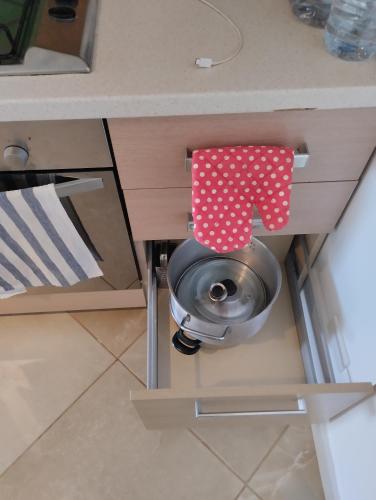 a kitchen counter with a bowl under a sink at Comfortable and spacious apartment with ocean views of Cabral beach in Sal Rei