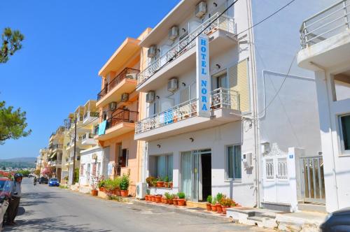 a building on the side of a street at Nora Hotel in Sitia