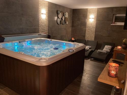 a large jacuzzi tub in a room at Penzión Fonte in Radava