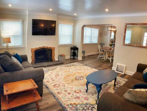 a living room with a couch and a fireplace at Centrally located, family and furry friendly fun! in Yakima