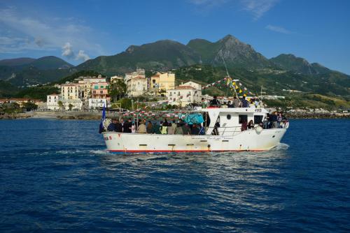 a group of people on a boat in the water at Hotel Cristina in Diamante