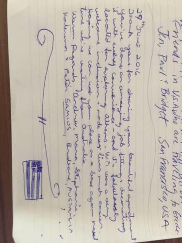 a writing on a sheet of paper with a cup at Athena's Nest- *best Location* A/C +HEAT! in Athens