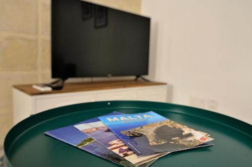 TV a/nebo společenská místnost v ubytování Città Cospicua suites