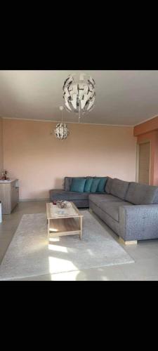 a living room with a couch and a coffee table at Elina's Maisonette in Episkopos
