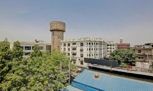 a view of a city with a water tower at Raj Darbar - 10 Meter From Golden Temple in Amritsar