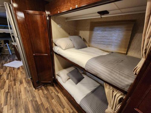 a small room with two beds in it at Paradise on Lake Harris unit RV#5 in Leesburg