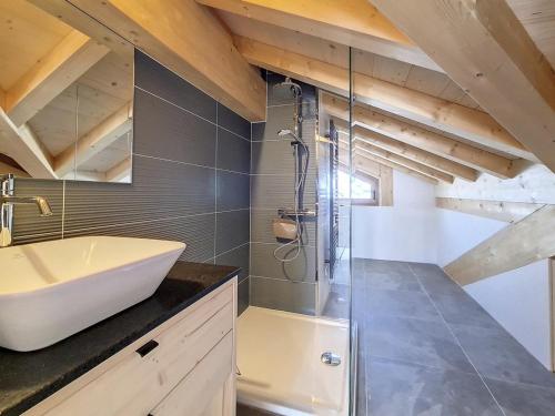 a bathroom with a sink and a shower at Chalet Saint-Martin-de-Belleville-Les Menuires, 5 pièces, 10 personnes - FR-1-344-1160 in Praranger