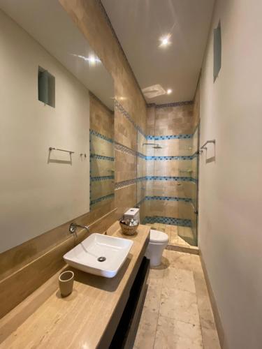 a bathroom with a sink and a toilet at Loft en Casa Colonial del Centro Histórico de Cartagena in Cartagena de Indias