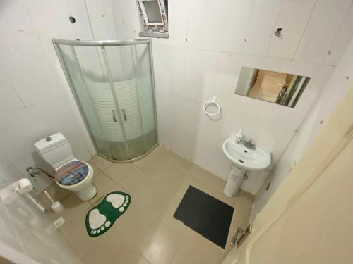 an overhead view of a bathroom with a toilet and sink at Private Room in Istanbul #103 in Arnavutköy